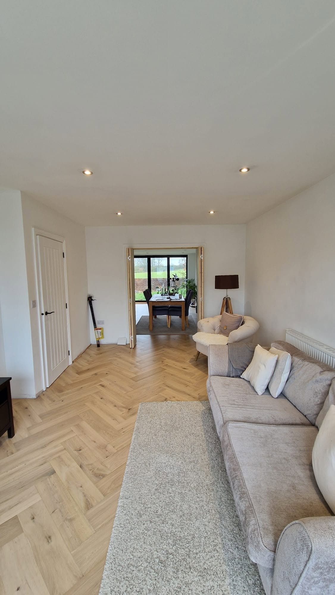 Living room downlighting with view through to the dining area, Boston Spa bungalow conversion.