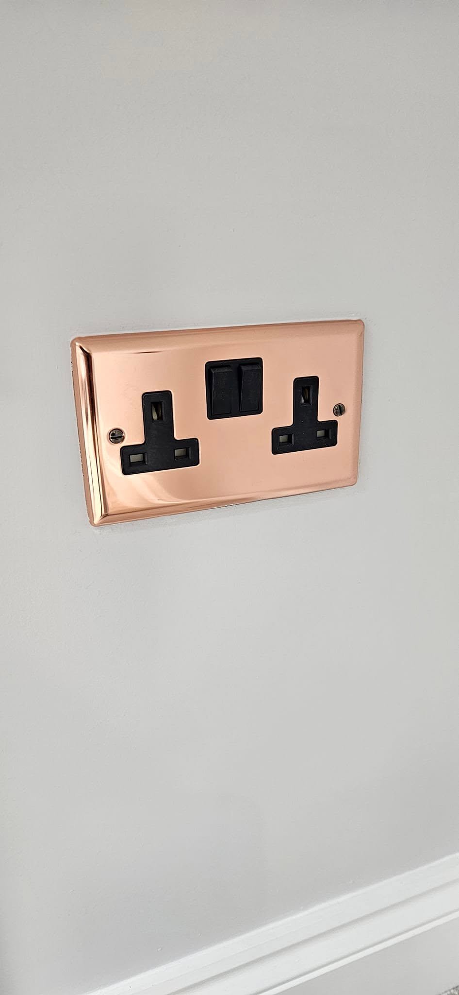 Copper-finish double socket installed as part of a loft conversion electrical fit-out, Leeds.
