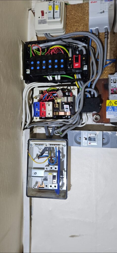 older fuseboard with multiple added circuits and wiring found in a Leeds property